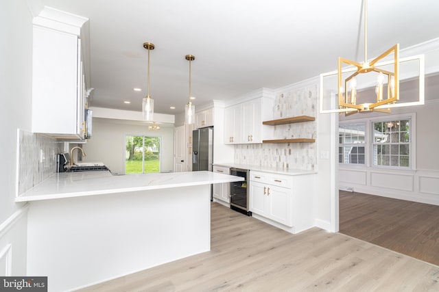 203 Shenandoah Rd, Cinnaminson, NJ 08077 - kitchen with wine cooler, white cabinets, light wood finished floors, stainless steel fridge, and open shelves