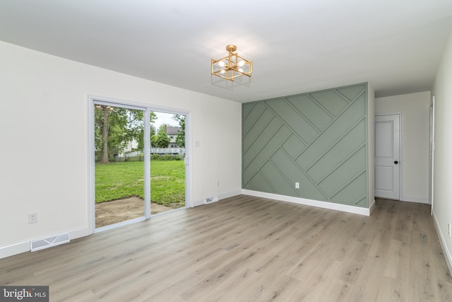 203 Shenandoah Rd, Cinnaminson, NJ 08077 - empty room featuring a chandelier, baseboards, and light wood-style floors