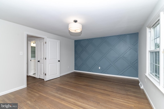 203 Shenandoah Rd, Cinnaminson, NJ 08077 - spare room featuring baseboards and wood finished floors
