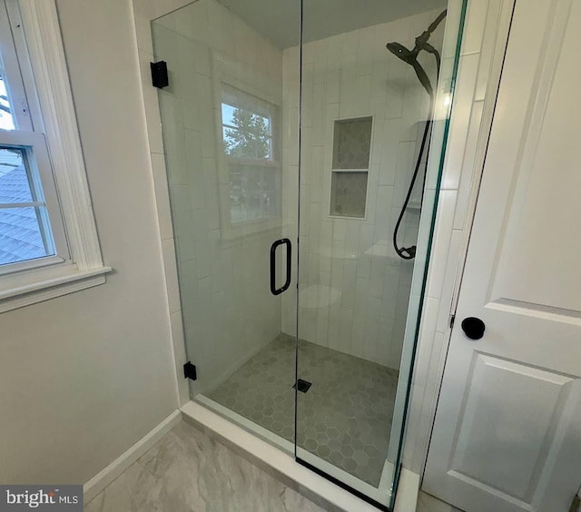 203 Shenandoah Rd, Cinnaminson, NJ 08077 - full bath with baseboards, plenty of natural light, a shower stall, and marble look tiles