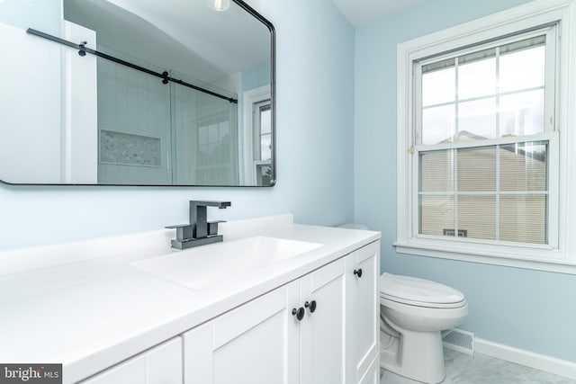203 Shenandoah Rd, Cinnaminson, NJ 08077 - bathroom featuring toilet, vanity, a shower with shower door, and marble look tiles