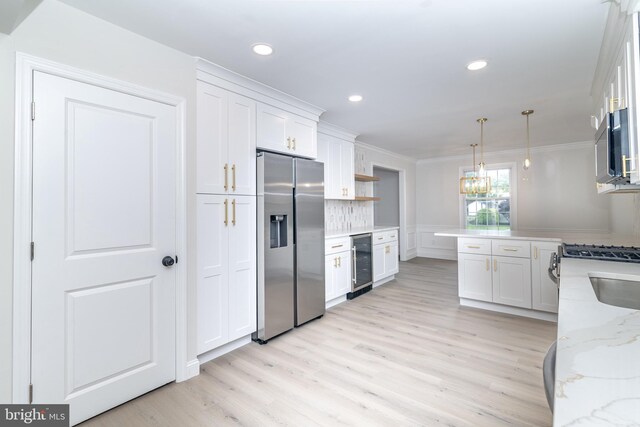 203 Shenandoah Rd, Cinnaminson, NJ 08077 - kitchen featuring stainless steel appliances, beverage cooler, white cabinets, light wood finished floors, and crown molding