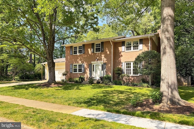 4785 Catterick Ct, Fairfax, VA 22032 - colonial house with brick siding, a garage, and a front lawn