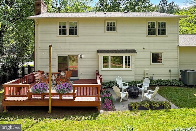 4785 Catterick Ct, Fairfax, VA 22032 - back of house with an outdoor fire pit, a chimney, central AC unit, a wooden deck, and a patio