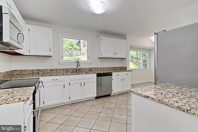 4785 Catterick Ct, Fairfax, VA 22032 - kitchen featuring appliances with stainless steel finishes, a sink, light tile patterned floors, and healthy amount of natural light