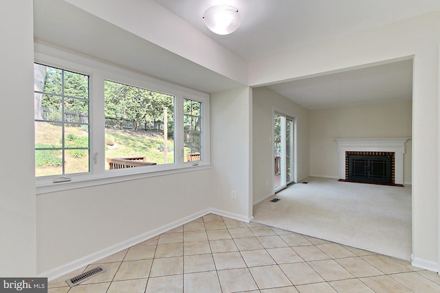 4785 Catterick Ct, Fairfax, VA 22032 - unfurnished living room with baseboards, a fireplace, light tile patterned floors, and light carpet