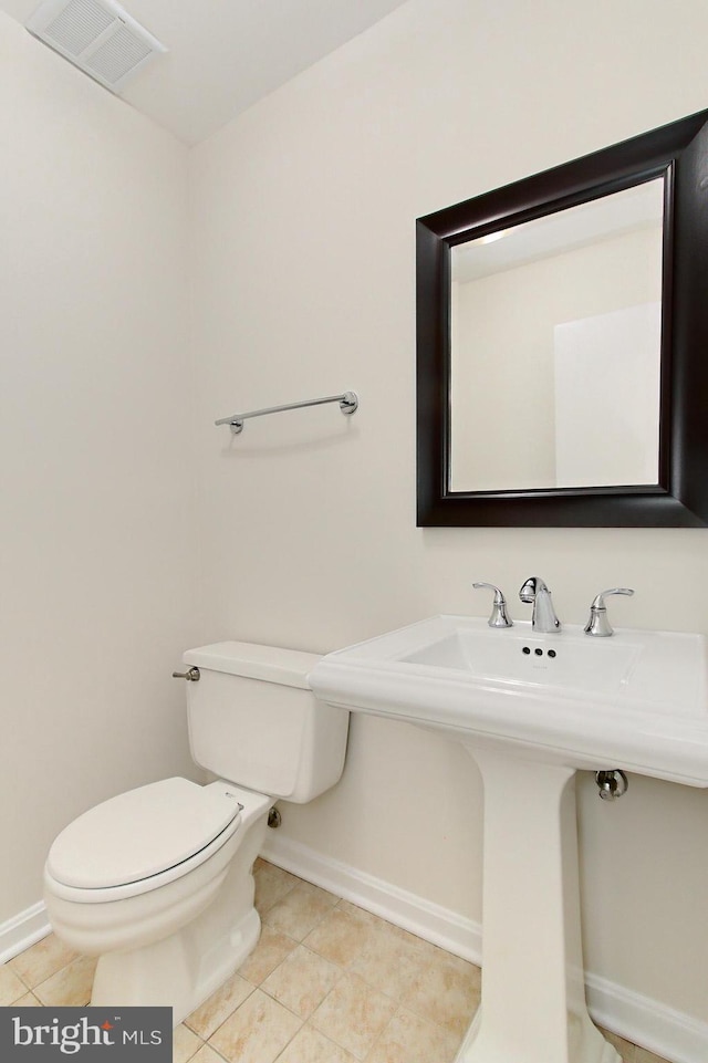 4785 Catterick Ct, Fairfax, VA 22032 - half bath featuring baseboards, toilet, tile patterned flooring, and a sink