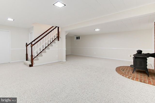 4785 Catterick Ct, Fairfax, VA 22032 - unfurnished living room with a wood stove, carpet floors, stairway, and baseboards