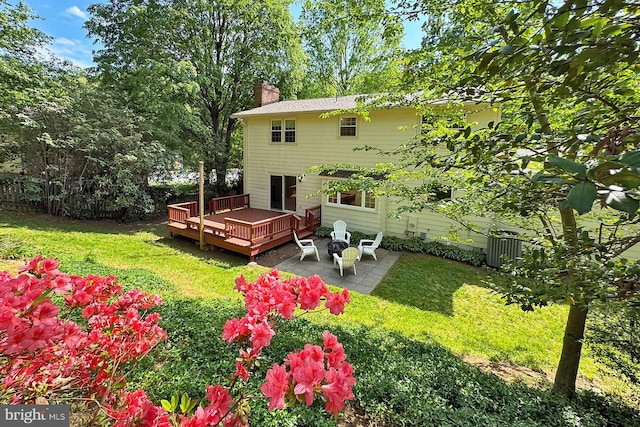4785 Catterick Ct, Fairfax, VA 22032 - back of property featuring a deck, a chimney, and a patio
