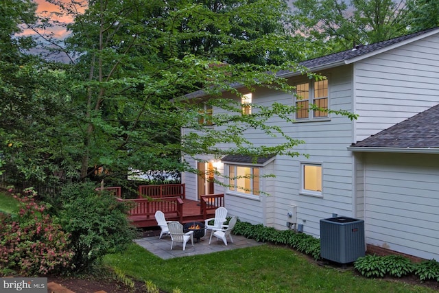 4785 Catterick Ct, Fairfax, VA 22032 - rear view of house with cooling unit, roof with shingles, a patio, a fire pit, and a yard