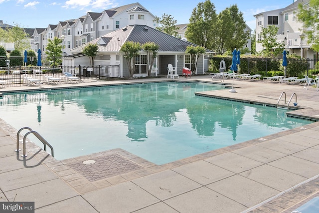 340 Shipyard Dr, Cambridge, MD 21613 - community pool featuring a patio, fence, and a residential view