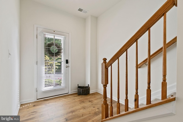 340 Shipyard Dr, Cambridge, MD 21613 - entryway featuring stairway, wood finished floors, and baseboards