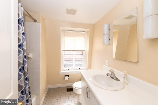 full bathroom featuring curtained shower, tile patterned floors, toilet, baseboards, and vanity