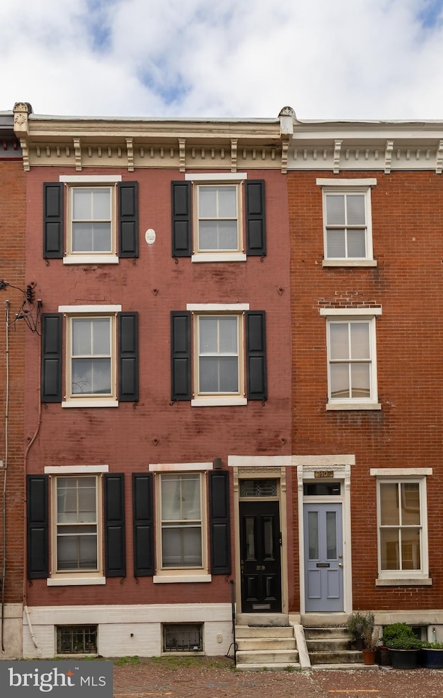view of front of house with brick siding