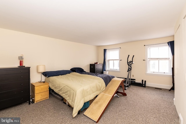 bedroom featuring carpet flooring and baseboards