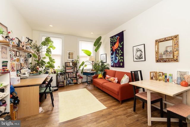 sitting room with wood finished floors and recessed lighting