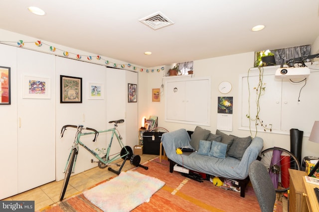 exercise area with recessed lighting and light tile patterned flooring