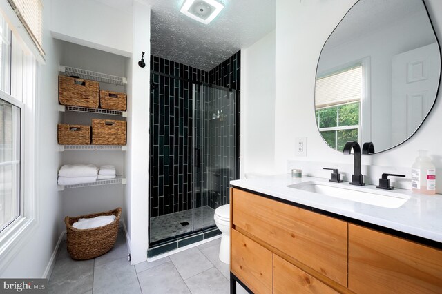 4783 Jaybird Ct, Waldorf, MD 20603 - full bathroom featuring toilet, a stall shower, tile patterned flooring, vanity, and baseboards