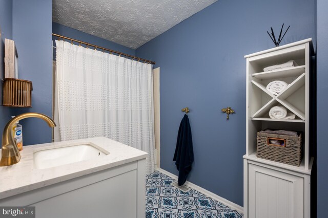 4783 Jaybird Ct, Waldorf, MD 20603 - full bath featuring vanity, a textured ceiling, baseboards, and a shower with shower curtain