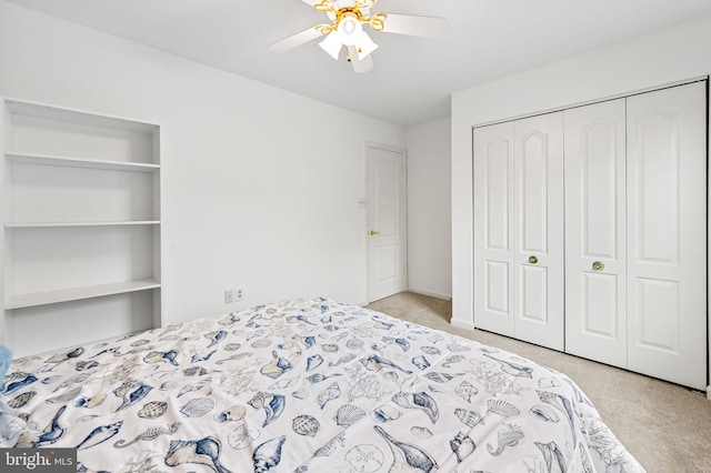 bedroom with light carpet, a closet, and ceiling fan