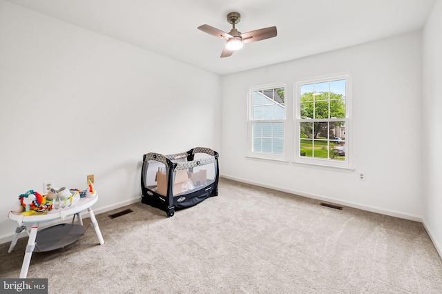 playroom with carpet, baseboards, and ceiling fan