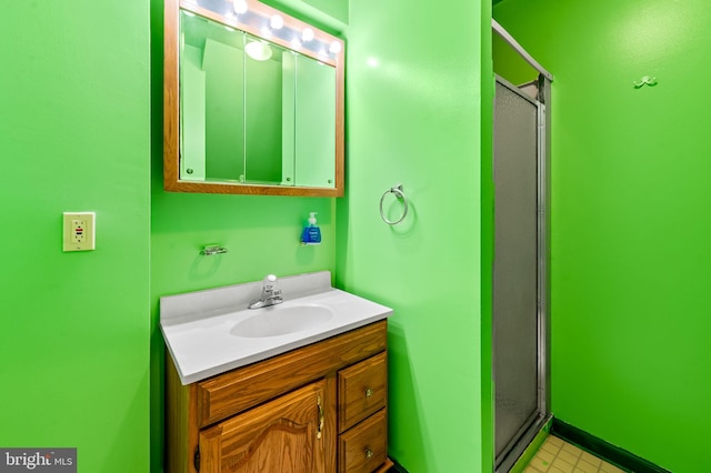 full bath featuring a stall shower and vanity