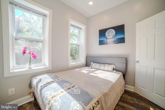 bedroom featuring baseboards, dark wood-style flooring, and recessed lighting