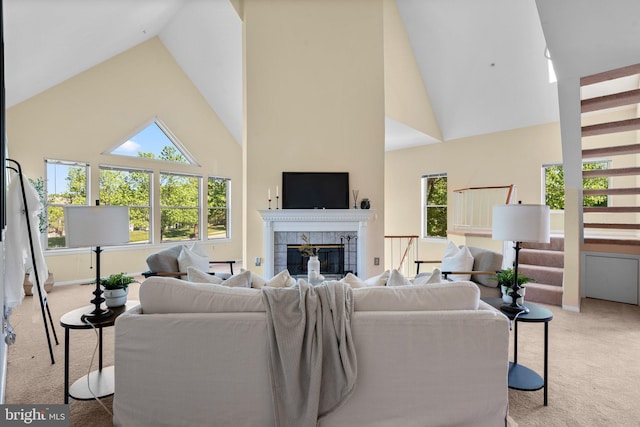 7617 Stony Creek Ln, Ellicott City, MD 21043 - living room featuring carpet flooring, high vaulted ceiling, plenty of natural light, and a tiled fireplace