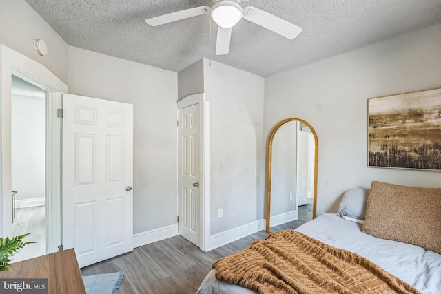 727 Willitts Ave, Audubon, NJ 08106 - bedroom with wood finished floors, a textured ceiling, baseboards, and a ceiling fan