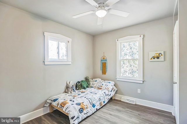 727 Willitts Ave, Audubon, NJ 08106 - bedroom featuring multiple windows, baseboards, wood finished floors, and a ceiling fan