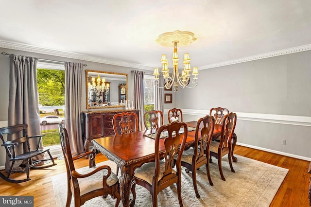94 N Woodland Ave, Woodbury, NJ 08096 - dining area with a chandelier, ornamental molding, wood finished floors, and baseboards