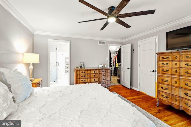 94 N Woodland Ave, Woodbury, NJ 08096 - bedroom featuring wood finished floors, crown molding, ensuite bathroom, baseboards, and a ceiling fan