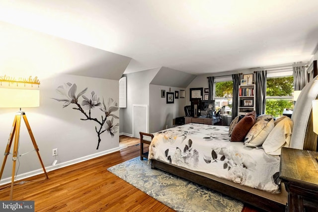 94 N Woodland Ave, Woodbury, NJ 08096 - bedroom with wood finished floors, lofted ceiling, and baseboards