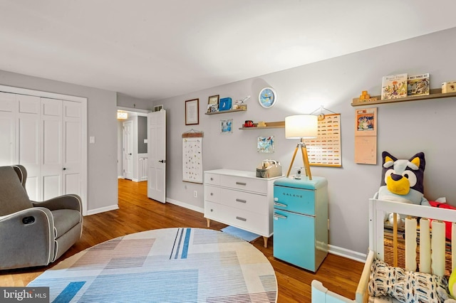 94 N Woodland Ave, Woodbury, NJ 08096 - bedroom with wood finished floors, baseboards, and a closet