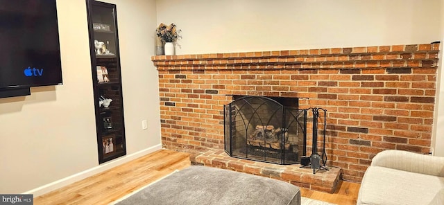 94 N Woodland Ave, Woodbury, NJ 08096 - detailed view of wood finished floors, baseboards, and a fireplace