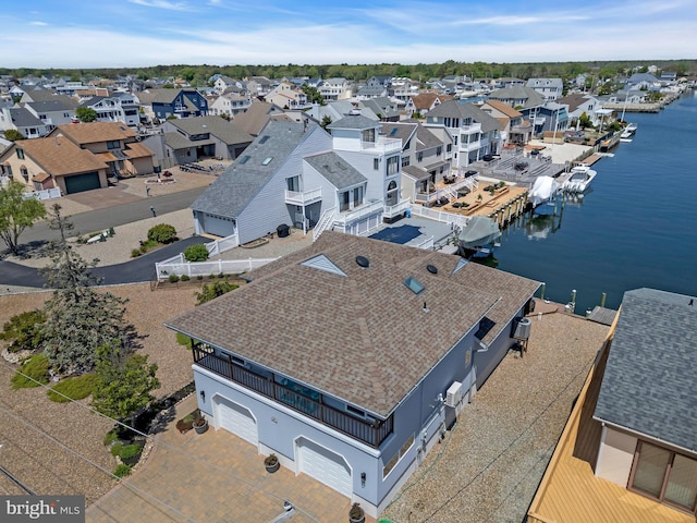 aerial perspective of suburban area featuring a large body of water