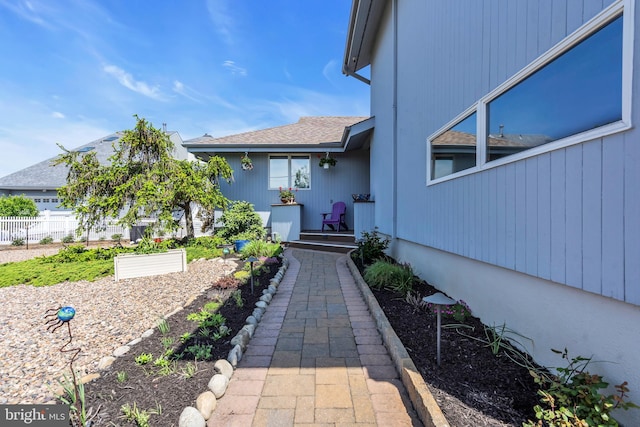 view of exterior entry with fence