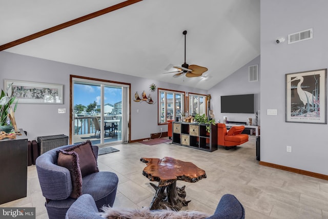 living room with a ceiling fan, baseboards, and high vaulted ceiling