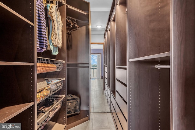 spacious closet with tile patterned flooring