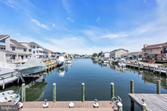 dock featuring a residential view and a water view