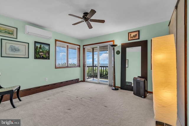 unfurnished room featuring an AC wall unit, a ceiling fan, carpet flooring, and baseboards