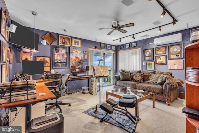 home office with track lighting, a wall mounted AC, carpet floors, and a ceiling fan