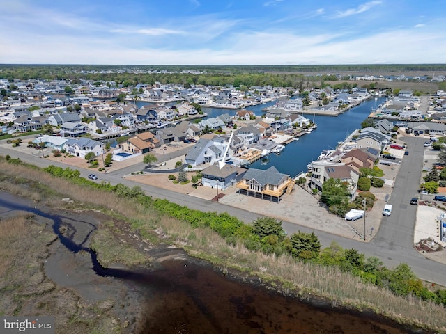 aerial view of residential area with a large body of water