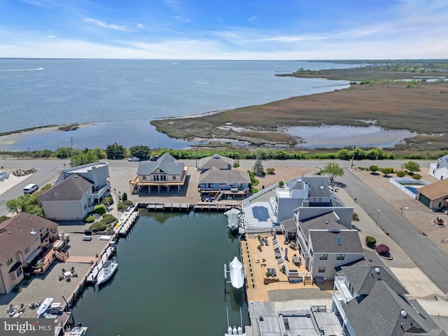 aerial perspective of suburban area featuring a nearby body of water