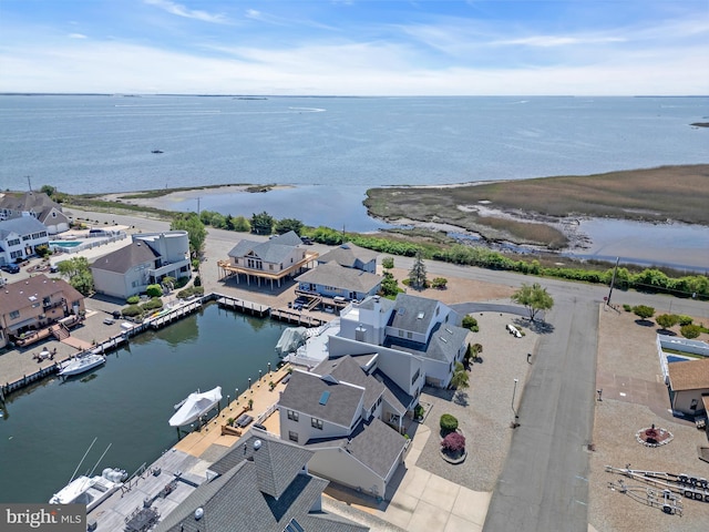 aerial view of residential area with a nearby body of water
