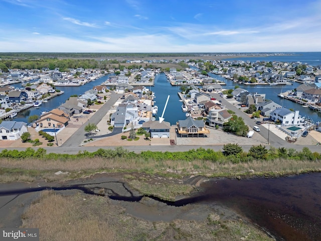 aerial view of residential area with a nearby body of water