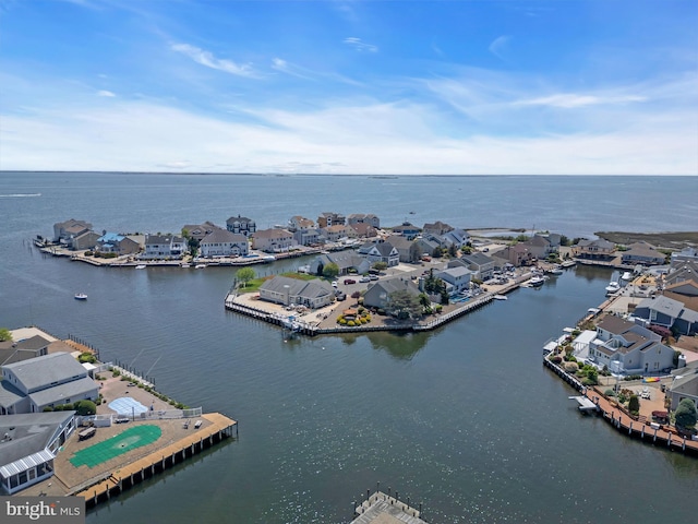aerial perspective of suburban area featuring a nearby body of water