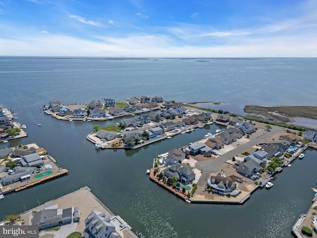 aerial perspective of suburban area featuring a nearby body of water