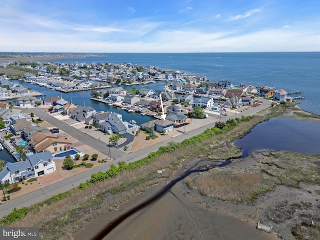 aerial perspective of suburban area featuring a nearby body of water