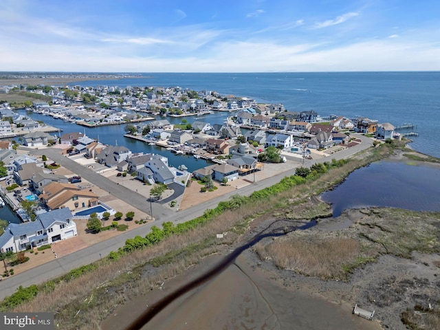 aerial perspective of suburban area with a nearby body of water